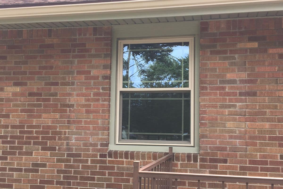 Double-pane window where failed seals allow moisture to cause haze between the glass panes