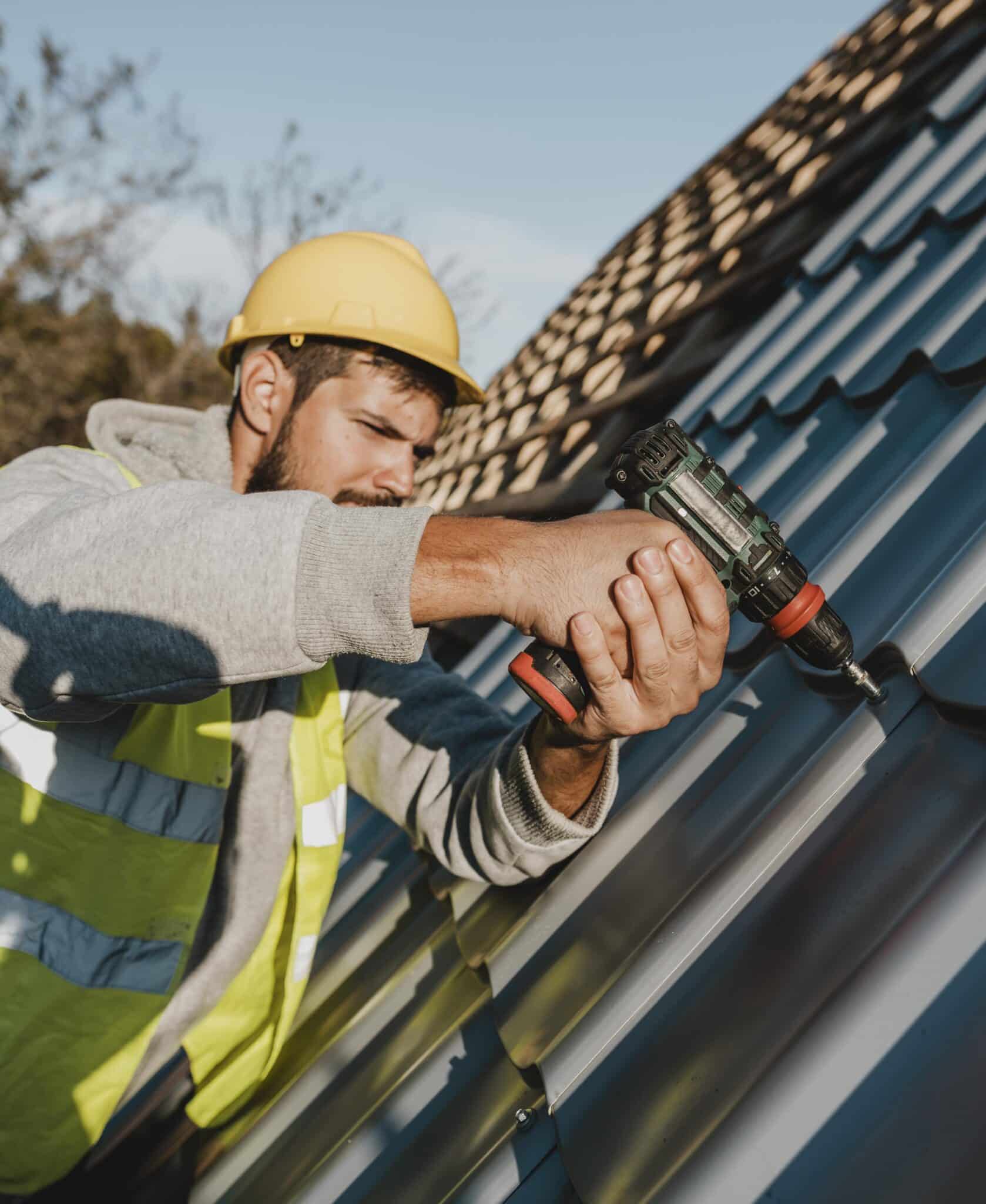 Man in hardhat working on roof.
