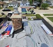 Roof decking preparation with materials staged by AllPoint Construction