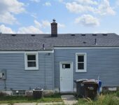 Rear exterior view after roof replacement by AllPoint Construction