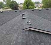 Close-up view of asphalt shingle roof installation by AllPoint Construction