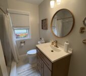 Bathroom remodel with new vanity and lighting by AllPoint Construction