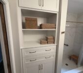 Bathroom storage cabinet installation by AllPoint Construction