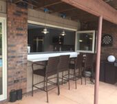Covered patio outdoor living space built by AllPoint Construction in Metro Detroit