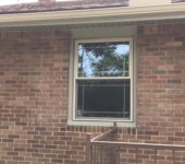 Replacement window installed in brick home by AllPoint Construction