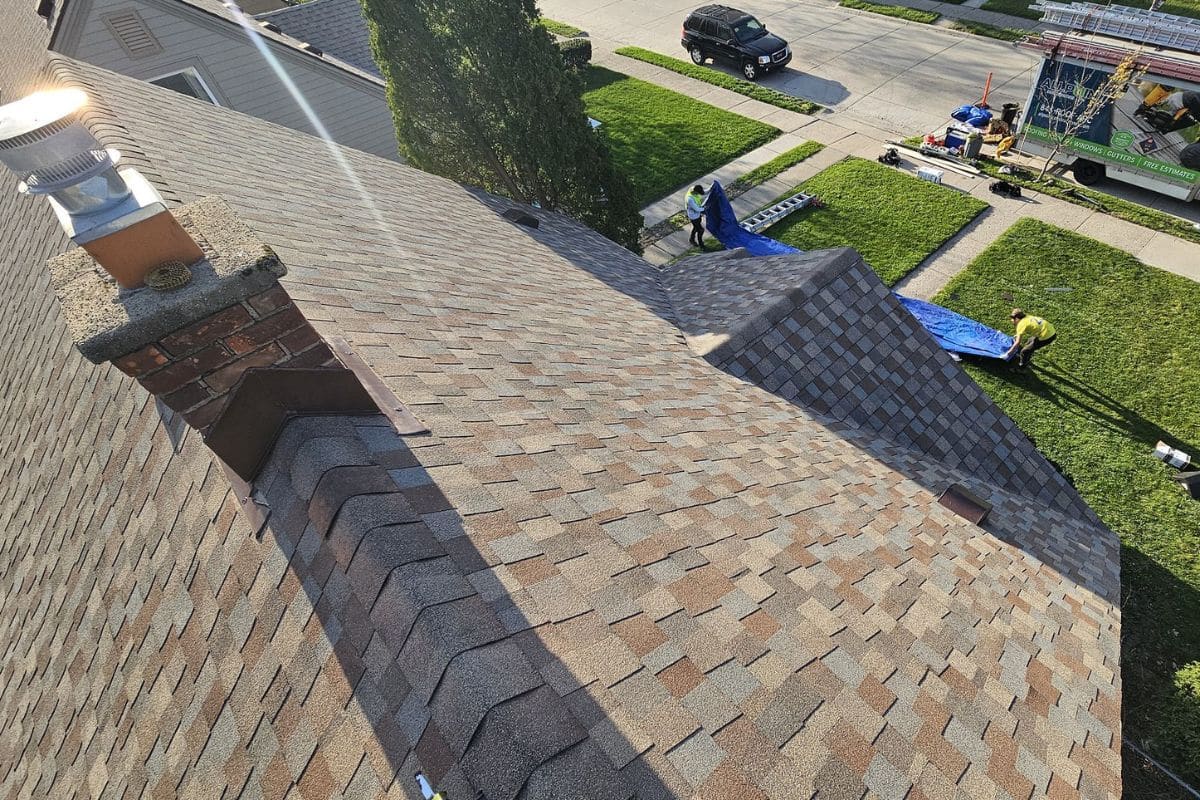 Exposed roof decking after shingle removal revealing potential hidden damage